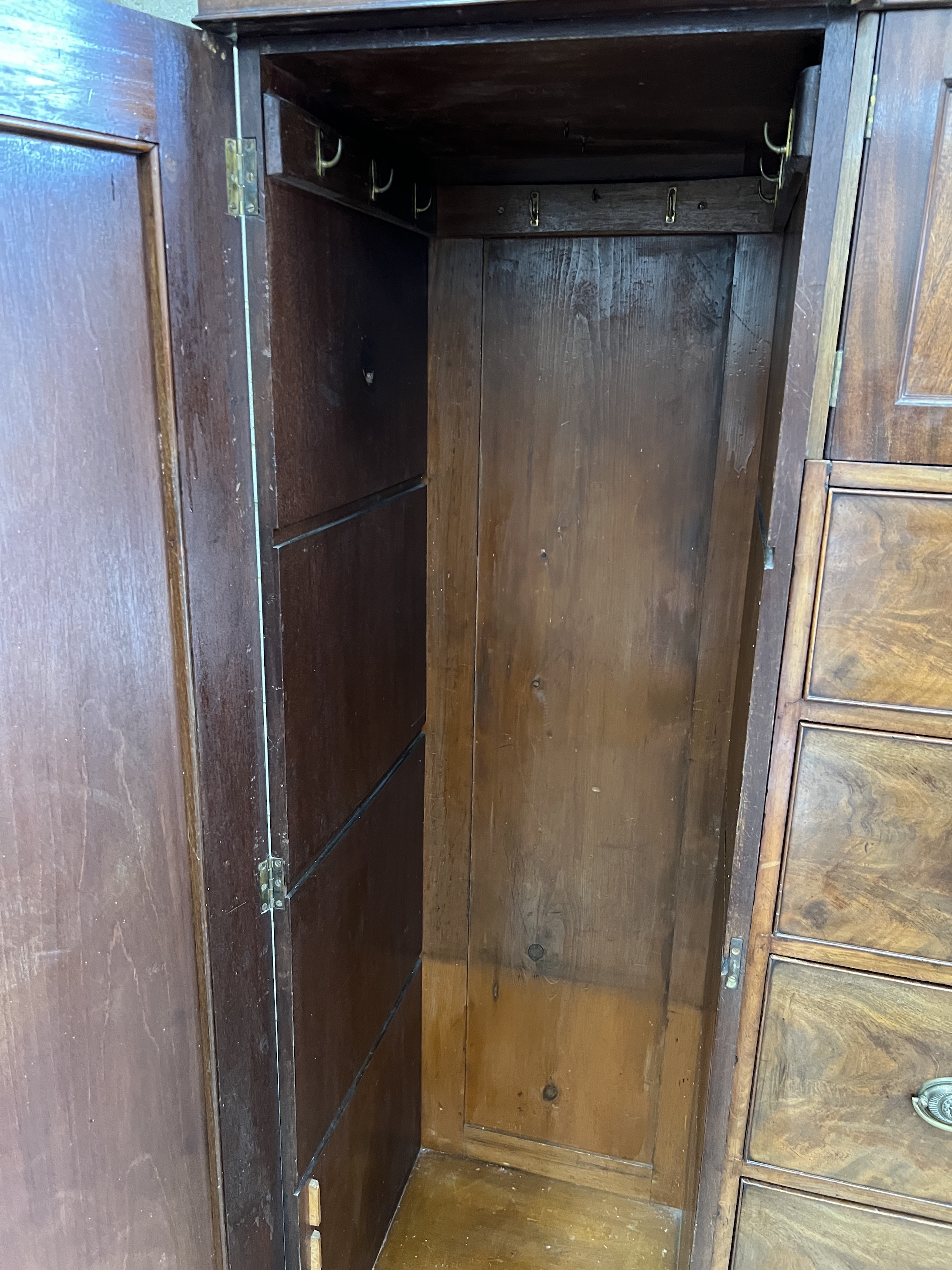 An early Victorian mahogany Beaconsfield wardrobe, width 232cm, depth 61cm, height 196cm